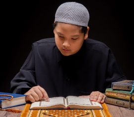 vecteezy a little asian muslim boy is sitting and reading the quran 52112766 scaled